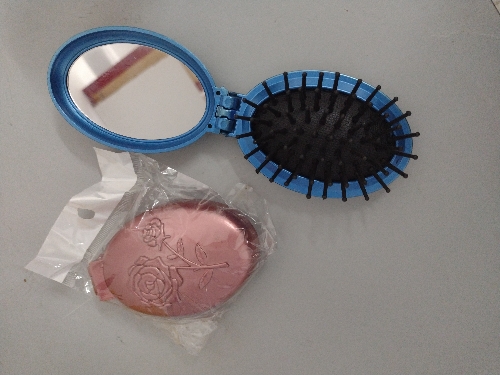 Cepillo ovalado plegable con espejo