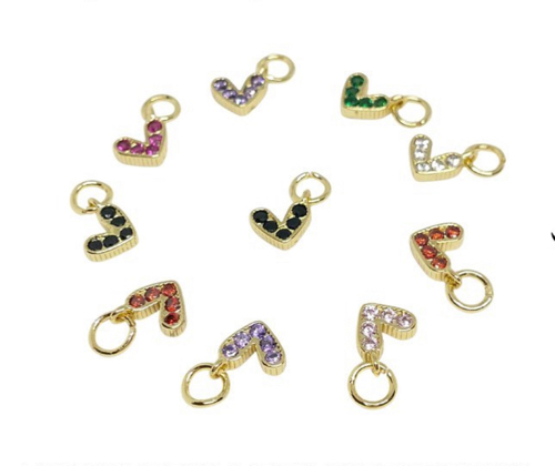 #04…Un Dije mini de corazón con zircones.