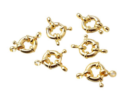 #12…Un Broche timón baño de oro grande