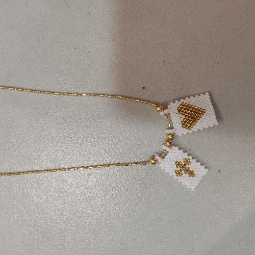 Collar con dijes de miyuqui (628)