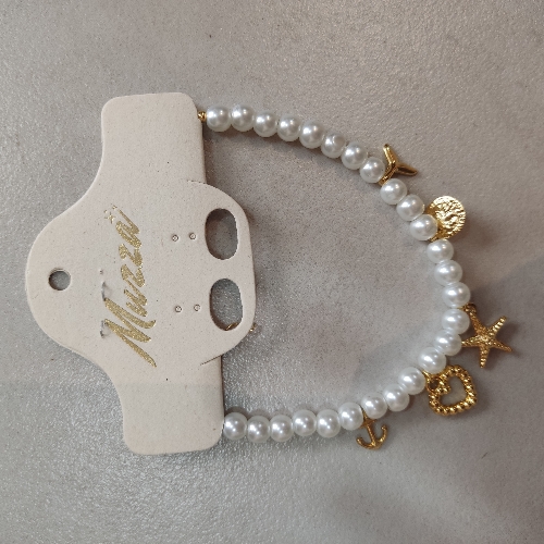 Pulsera perla con dijes (743)