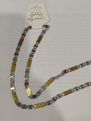 CADENA EN ACERO PLANA 2 TONOS LABRADO DOBLE S EN ESLABON DORADO  CSA00064
